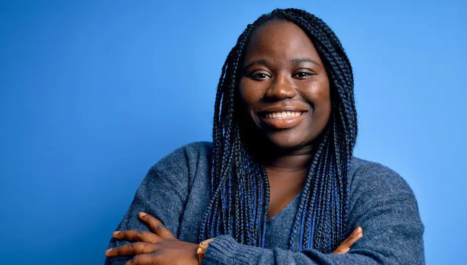 A woman wearing blue showing her personality off