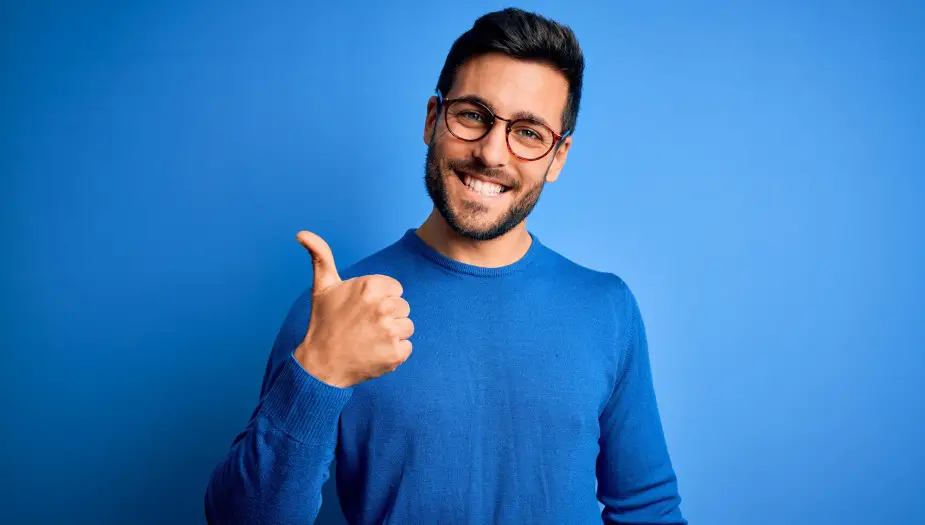 A man wearing blue exited about his blue personality type