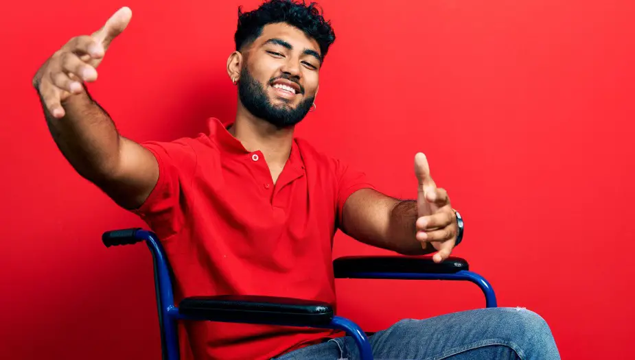 man wearing red reaching out for strength