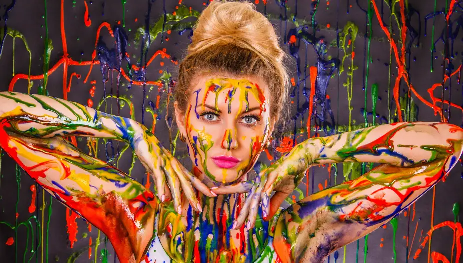 women with red blue green yellow paint showing her personality
