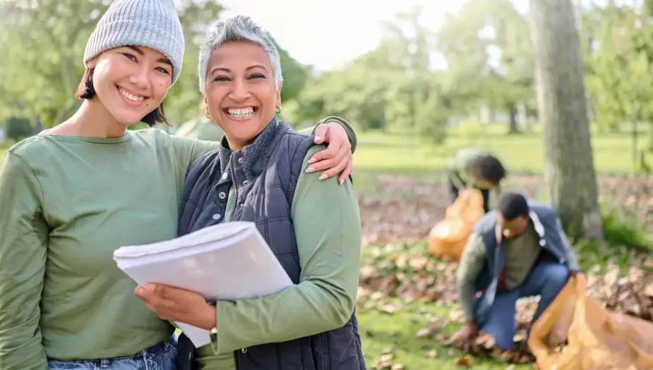 green leader in field helping others